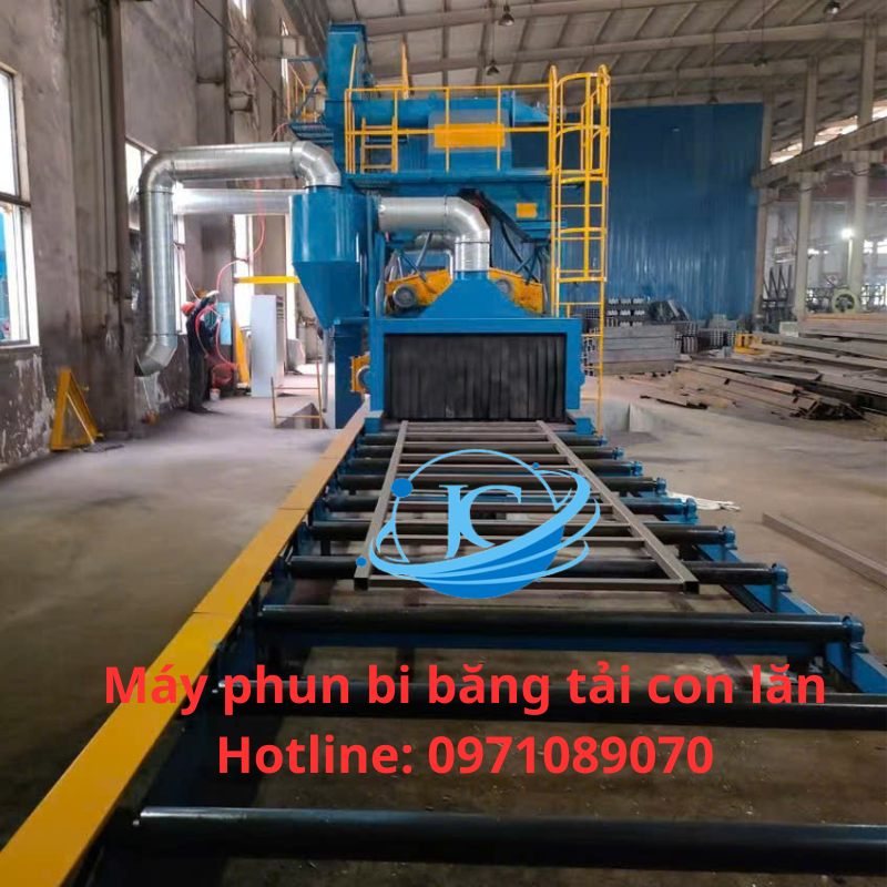 Máy Phun Bi Băng Tải Con Lăn
